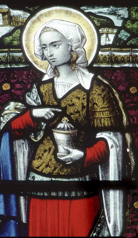 Mary Magdalene is pictured in a stained-glass window in the Church of St. Waudru in Mons, Belgium. (CNS photo)
